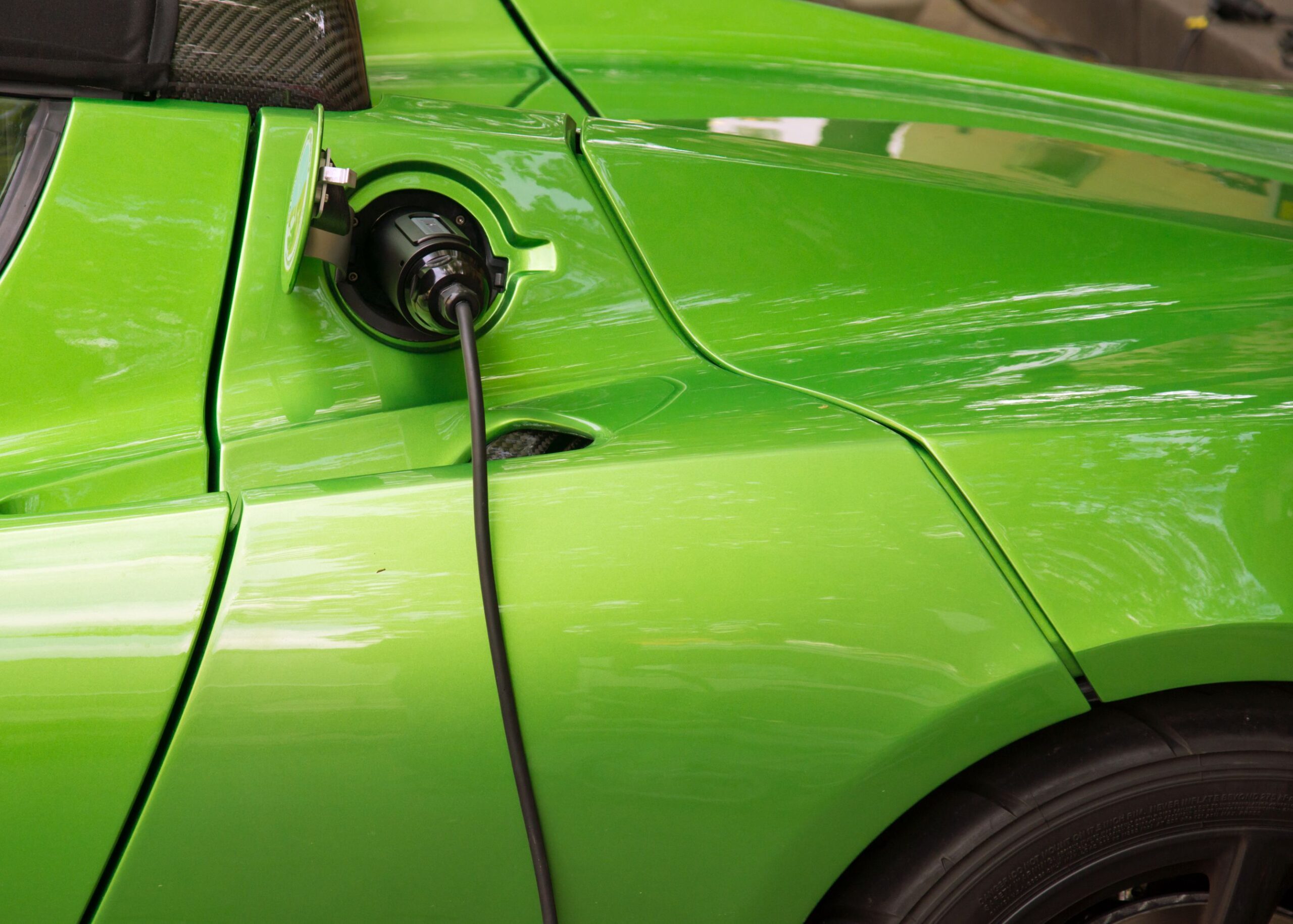 Green sports car electric charging